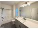 Bright, modern bathroom featuring a large vanity, undermount sink, and a combined bathtub and shower at 227 Wet Wood Ct, Fairburn, GA 30213
