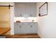Built-in gray storage cabinets with light countertops and light walls at 227 Wet Wood Ct, Fairburn, GA 30213