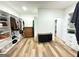Walk-in closet with hardwood floors, custom shelving, drawers, and organized storage at 227 Wet Wood Ct, Fairburn, GA 30213