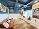 Cozy living area featuring built-in shelves, a comfortable sofa, and recessed lighting, ideal for relaxation at 227 Wet Wood Ct, Fairburn, GA 30213