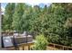 Backyard with deck and patio area showcasing private greenery at 150 Murphy Creek Ln, Fayetteville, GA 30215