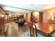 Finished basement featuring dark wood flooring, stairs and a billiard table in the distance at 150 Murphy Creek Ln, Fayetteville, GA 30215