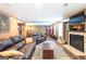 Finished basement with a fireplace, sitting area, billiard table and dark wood flooring at 150 Murphy Creek Ln, Fayetteville, GA 30215