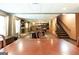Finished basement with a fireplace, staircase, bar and multiple seating areas at 150 Murphy Creek Ln, Fayetteville, GA 30215