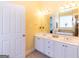 Bathroom features a vanity with dual sinks and a large mirror at 150 Murphy Creek Ln, Fayetteville, GA 30215