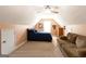 This bedroom has carpet flooring, an egress window, a ceiling fan, and a comfortable couch at 150 Murphy Creek Ln, Fayetteville, GA 30215