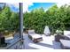 Spacious deck with plush seating, an outdoor grill, and lush greenery, creating a serene backyard retreat at 150 Murphy Creek Ln, Fayetteville, GA 30215