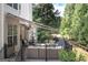 Inviting deck with ample seating, an outdoor grill, and a serene atmosphere for relaxing and entertaining guests at 150 Murphy Creek Ln, Fayetteville, GA 30215