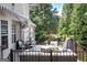 Spacious outdoor deck featuring stylish furniture, a grill, and black awning, perfect for entertaining at 150 Murphy Creek Ln, Fayetteville, GA 30215