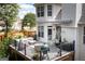 Inviting deck featuring cozy seating, stylish decor, and a lovely setting for outdoor entertainment and leisure at 150 Murphy Creek Ln, Fayetteville, GA 30215