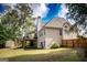 Charming home showcasing a spacious backyard, a covered patio, and a well-kept exterior at 150 Murphy Creek Ln, Fayetteville, GA 30215