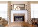 Cozy brick fireplace with decorative mantel, perfect for creating a warm atmosphere at 150 Murphy Creek Ln, Fayetteville, GA 30215