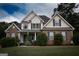 Attractive two-story home with brick accents, neatly trimmed greenery, and a well-cared-for lawn at 150 Murphy Creek Ln, Fayetteville, GA 30215