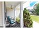 Inviting front porch with comfortable seating and green cushions at 150 Murphy Creek Ln, Fayetteville, GA 30215