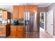 Kitchen featuring stainless steel refrigerator, custom wood cabinets, and modern appliances at 150 Murphy Creek Ln, Fayetteville, GA 30215
