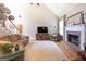 Comfortable living room with a fireplace, TV, and vaulted ceiling at 150 Murphy Creek Ln, Fayetteville, GA 30215