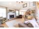 Cozy living room with a fireplace, hardwood floors, and an open layout to the kitchen at 150 Murphy Creek Ln, Fayetteville, GA 30215