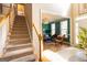 Charming view of the living room features a staircase and stylish accents at 150 Murphy Creek Ln, Fayetteville, GA 30215