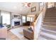 Spacious living room with a fireplace, hardwood floors, and a view of the staircase at 150 Murphy Creek Ln, Fayetteville, GA 30215