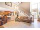 Bright living room features a high ceiling, staircase, and comfortable seating area at 150 Murphy Creek Ln, Fayetteville, GA 30215