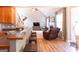 Open-concept living room featuring hardwood floors, high ceilings, and a cozy fireplace at 150 Murphy Creek Ln, Fayetteville, GA 30215