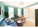 Inviting living room with hardwood floors, comfortable seating, and bright windows at 150 Murphy Creek Ln, Fayetteville, GA 30215
