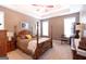 Main bedroom features neutral walls and a four-poster bed at 150 Murphy Creek Ln, Fayetteville, GA 30215