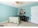 The office has a ceiling fan, carpet flooring, and aqua-painted walls to create a calm work environment at 150 Murphy Creek Ln, Fayetteville, GA 30215