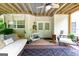 Covered patio featuring swing, ceiling fan, and furniture at 150 Murphy Creek Ln, Fayetteville, GA 30215