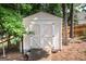 Outdoor shed with double doors and neutral paint at 150 Murphy Creek Ln, Fayetteville, GA 30215