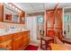 Functional bathroom featuring double vanity, walk-in shower, tiled walls, and ample storage space for essential toiletries and linens at 1813 Freeman Rd, Jonesboro, GA 30236