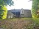 View of the backyard, showing the back of the house and the deck at 565 Miles Ct, Locust Grove, GA 30248