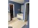 Bathroom featuring a soaking tub and a walk in closet at 565 Miles Ct, Locust Grove, GA 30248