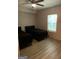 Bedroom with wood-look floors, two twin beds and ceiling fan at 565 Miles Ct, Locust Grove, GA 30248