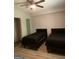 Bedroom with wood-look floors, two twin beds and ceiling fan at 565 Miles Ct, Locust Grove, GA 30248