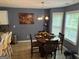 Dining area bathed in natural light with a table set for a meal, perfect for gatherings and everyday dining at 565 Miles Ct, Locust Grove, GA 30248