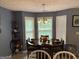 Dining area bathed in natural light with a table set for a meal, perfect for gatherings and everyday dining at 565 Miles Ct, Locust Grove, GA 30248