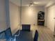 Bright dining room with light wood flooring and modern track lighting at 565 Miles Ct, Locust Grove, GA 30248