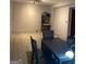 Bright dining room with light wood flooring and modern track lighting at 565 Miles Ct, Locust Grove, GA 30248