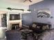 Open-concept living room with a fireplace, providing a warm ambiance and seamless flow for entertaining and relaxation at 565 Miles Ct, Locust Grove, GA 30248