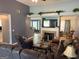 Inviting living room with a fireplace, offering a cozy atmosphere and modern decor, perfect for comfortable living at 565 Miles Ct, Locust Grove, GA 30248