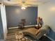 Bright sitting area with a rocking chair and patterned rug, perfect for relaxation and enjoying natural light at 565 Miles Ct, Locust Grove, GA 30248