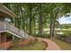 Backyard view of golf course with pond and wooded area at 5028 Chapel Lake Cir, Douglasville, GA 30135