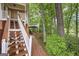 Beautiful backyard featuring a red brick stairway and walkway with mature trees at 5028 Chapel Lake Cir, Douglasville, GA 30135