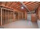 Unfinished basement featuring exposed wood framing and painted floor with utility access at 5028 Chapel Lake Cir, Douglasville, GA 30135
