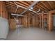 Unfinished basement with exposed wooden framing, ductwork, and concrete flooring at 5028 Chapel Lake Cir, Douglasville, GA 30135