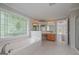 Bright bathroom features a soaking tub and a decorative stained-glass window at 5028 Chapel Lake Cir, Douglasville, GA 30135