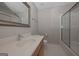 Clean bathroom featuring a shower and tub with a single vanity and chrome faucet at 5028 Chapel Lake Cir, Douglasville, GA 30135