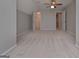 Large bedroom featuring a ceiling fan, carpet and two doorways to closets at 5028 Chapel Lake Cir, Douglasville, GA 30135