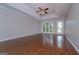 Bright bedroom with hardwood floors, a ceiling fan, recessed lights, and access to a balcony at 5028 Chapel Lake Cir, Douglasville, GA 30135